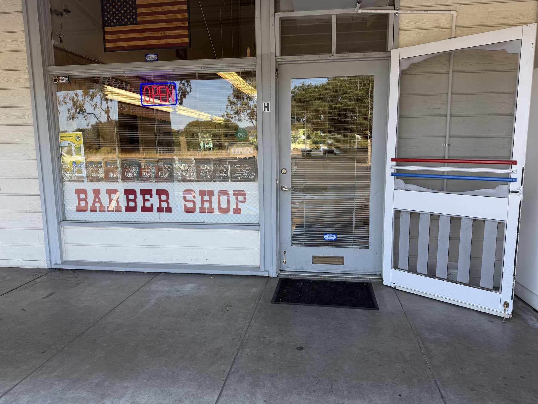 Village Barber Shop storefront in Vandenberg Village, California